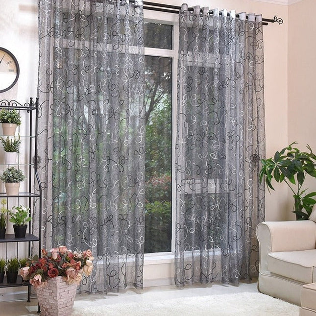 Transparente Gardine mit verspielter Stickerei